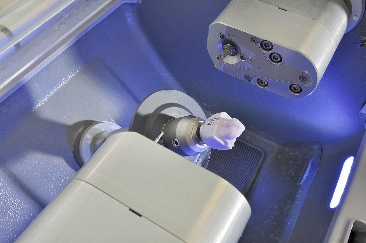 Ceramic restoration being milled by CEREC technology
