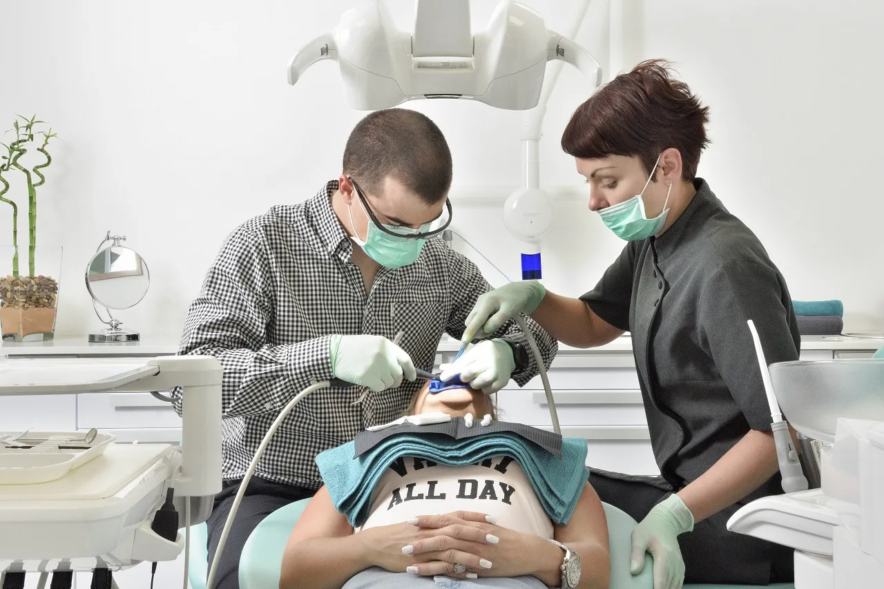 Dr Alberts and assistant caring for a patient